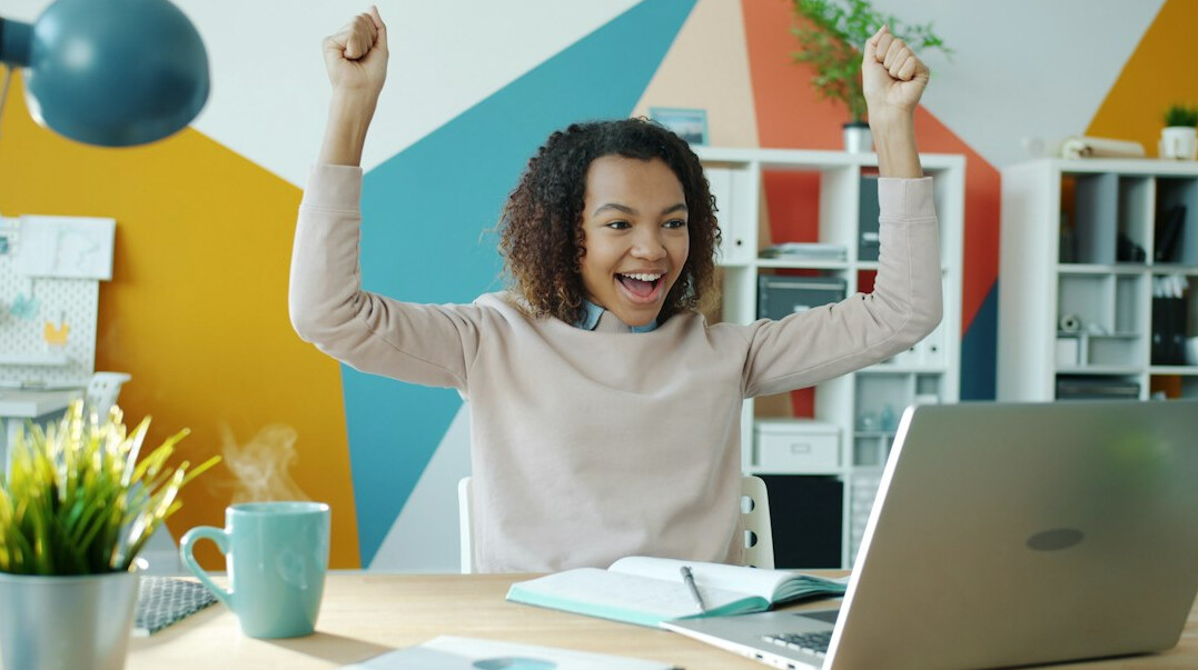 person stretching at desk