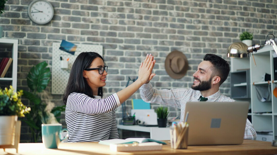 office workers stretching at desk